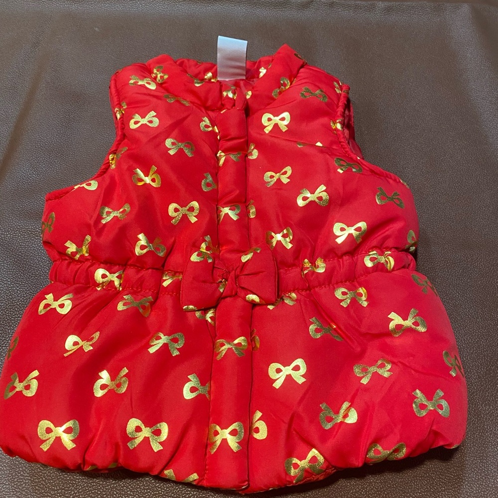 Red Puffer Vest with Gold Bow Pattern - Picture 1 of 6
